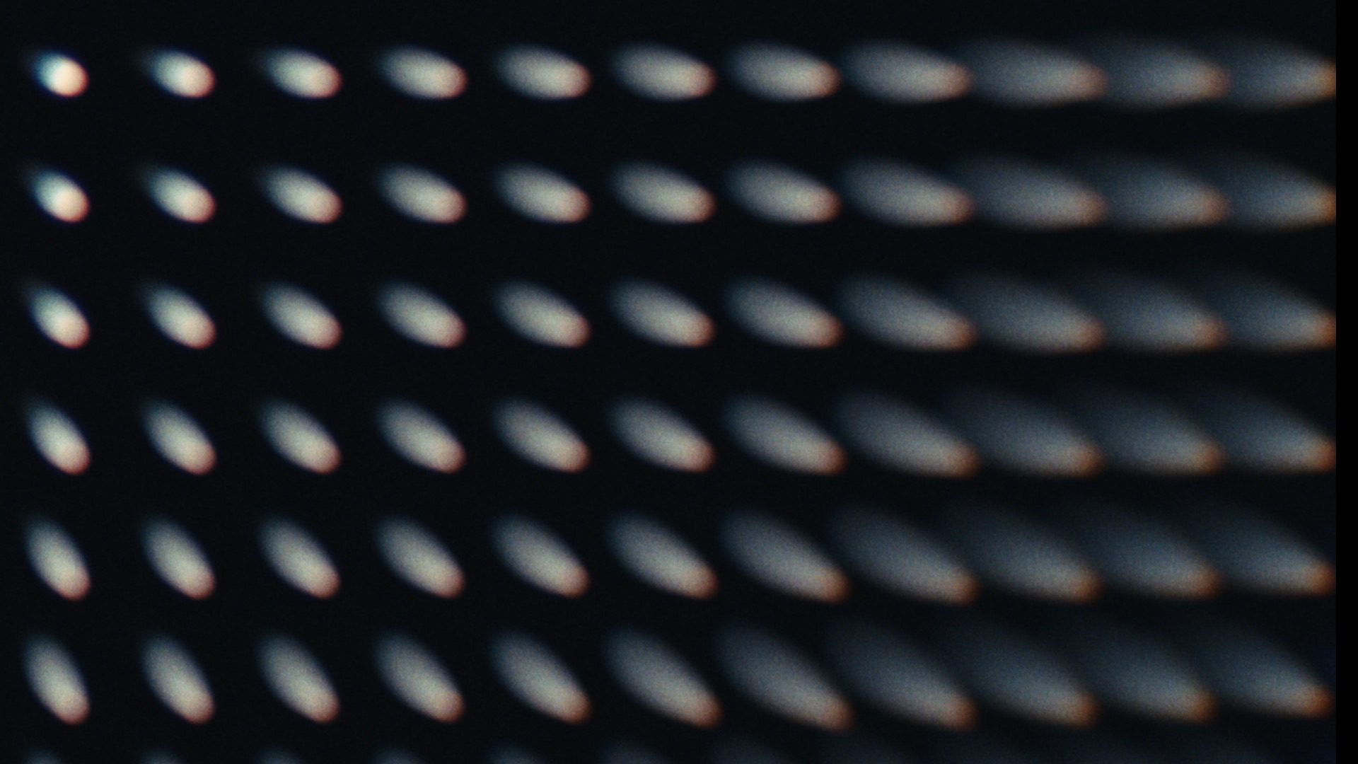 Footage with comatic aberration applied, showing directional blooming and smearing of highlights toward the edges of the frame
